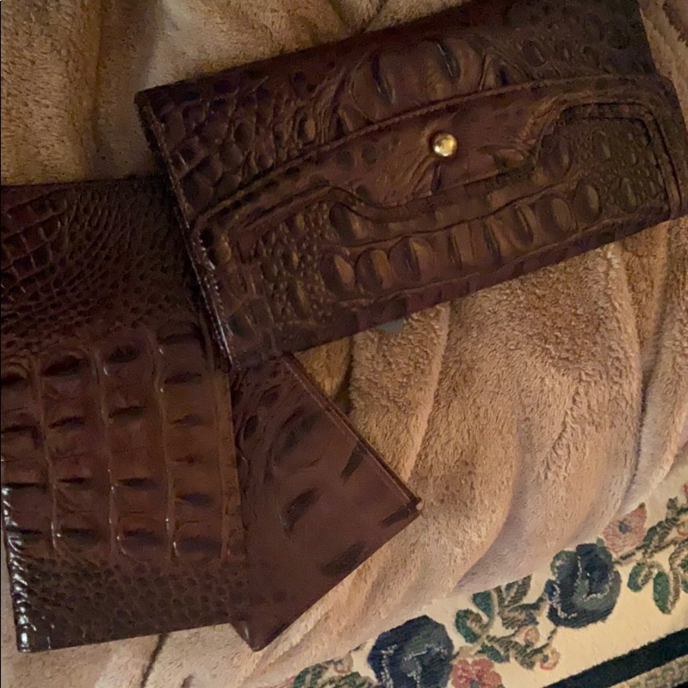 a Brahmin check book and 2 inserts